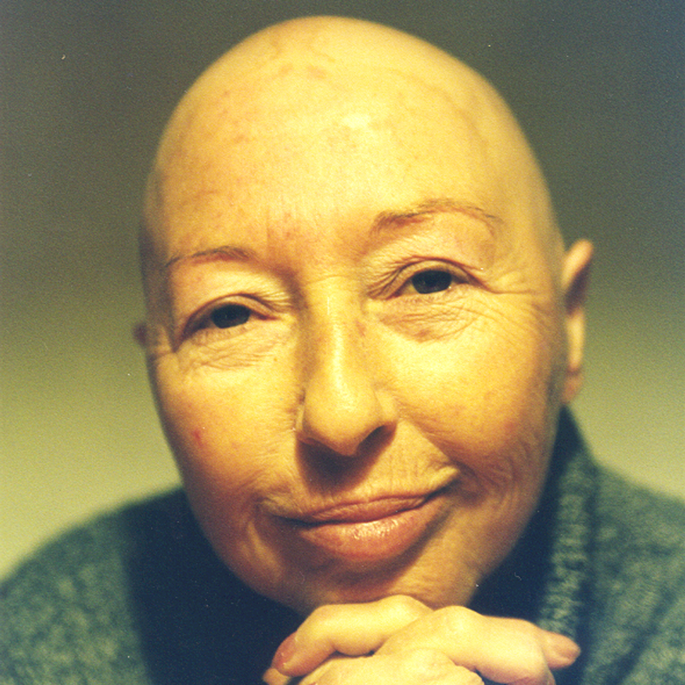 Bald smiling woman in her fourties or fifties
